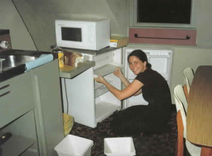 Sarah cleans the fridge in our 20 a week flat