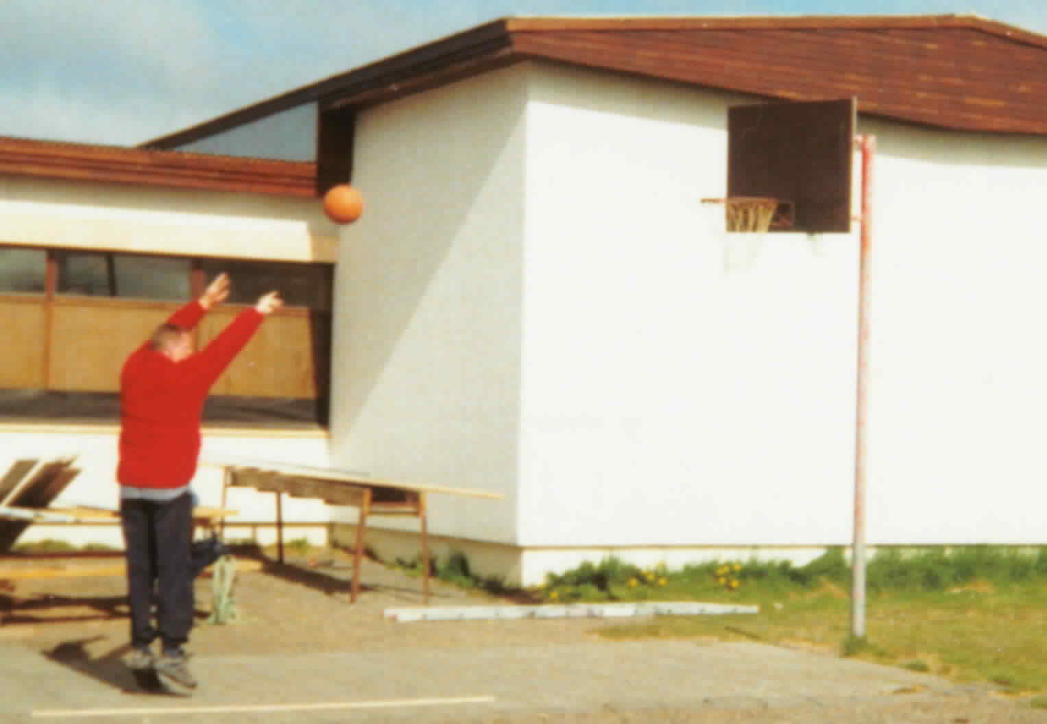 David shoots a basket in the arctic circle at the local school/community centre